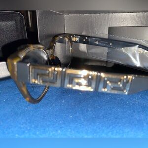 Versace new glasses. Never used with case and cleaning cloth. Excellent quality
